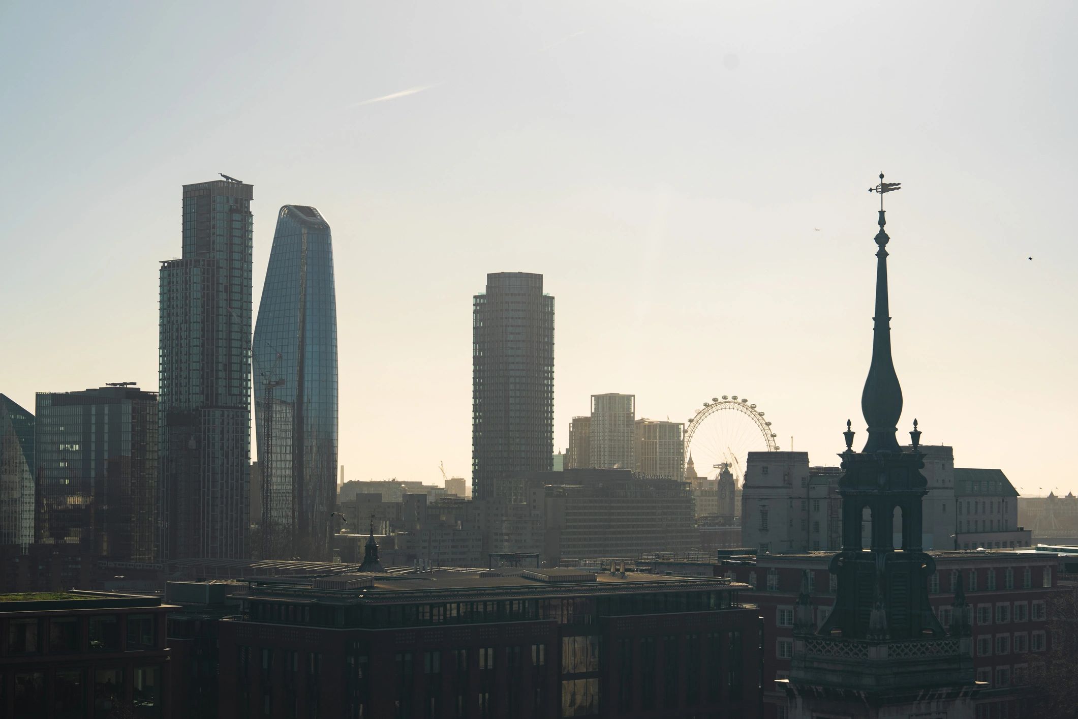 London cityscape featuring church spire and modern skyscrapers
